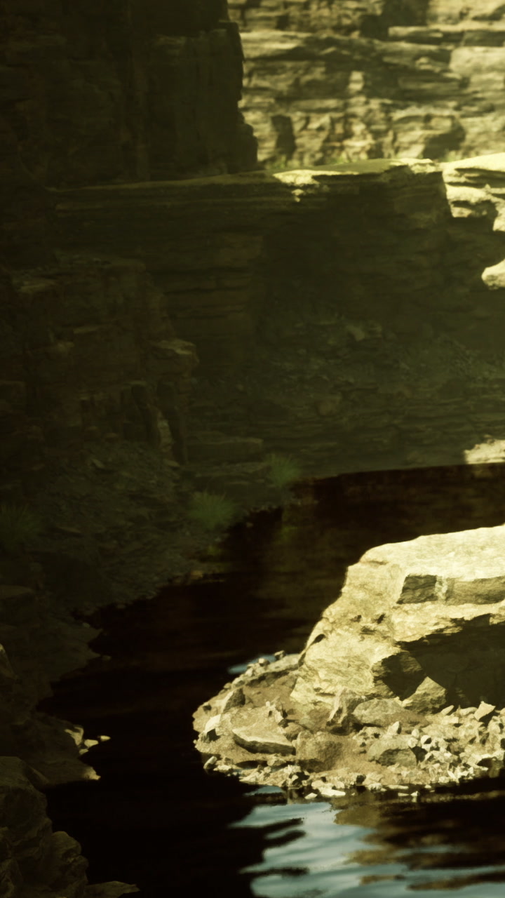 Mystical river flows through ancient canyon under soft golden light