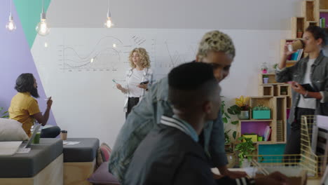 young multi ethnic business people brainstorming students collaborating discussing creative ideas working together in busy diverse office sharing communication enjoying teamwork