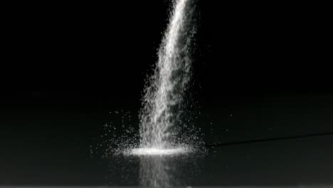 검은 배경 에 소금 을 뿌리는 것