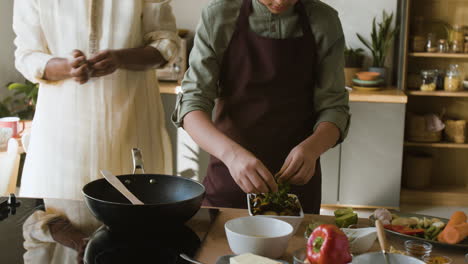 person preparing a meal in a modern kitchen