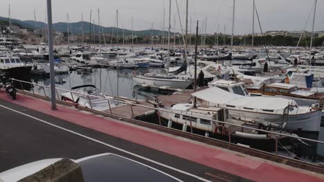 slow motion shot walking towards a port full of boats