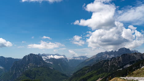 time lapse of white clouds forming on a bright blue sky over mountains in triglav national park slovenia