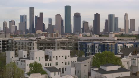 pushing forward drone shot of downtown houston and surrounding cityscape