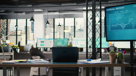 vertical video quiet corporate space equipped with a laptop and performance reports
