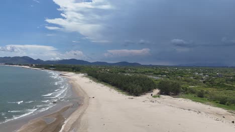 aerial view pan of the secret beach and the stormy clouds in vung tau