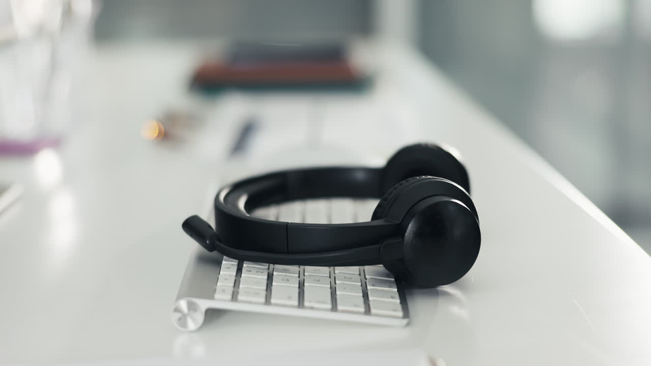 Headphones on Keyboard at Desk