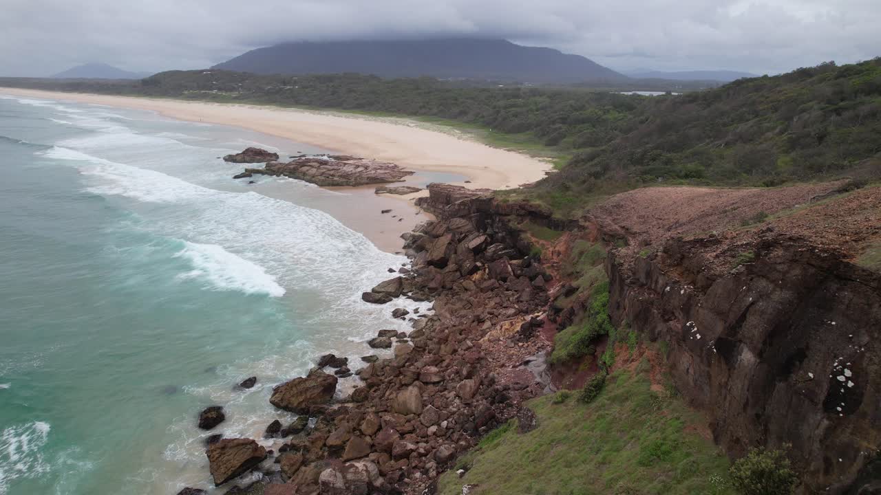 Rock Formation At Charles Hamey Lookout With View Of Dunbogan Beach In Barrington Coast, NSW, Australia. drone shot