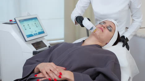 woman undergoing laser facial treatment