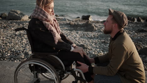 couple at the beach - support and care