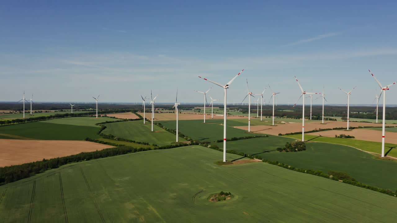 Aerial View of Wind Farm over Agricultural Fields