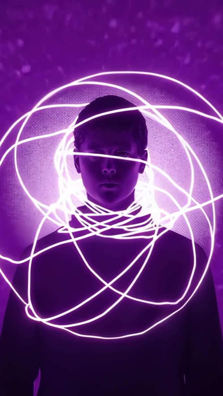 Vertical video: LED rope starting swirling neon halo around subject in top and cap in purple studio