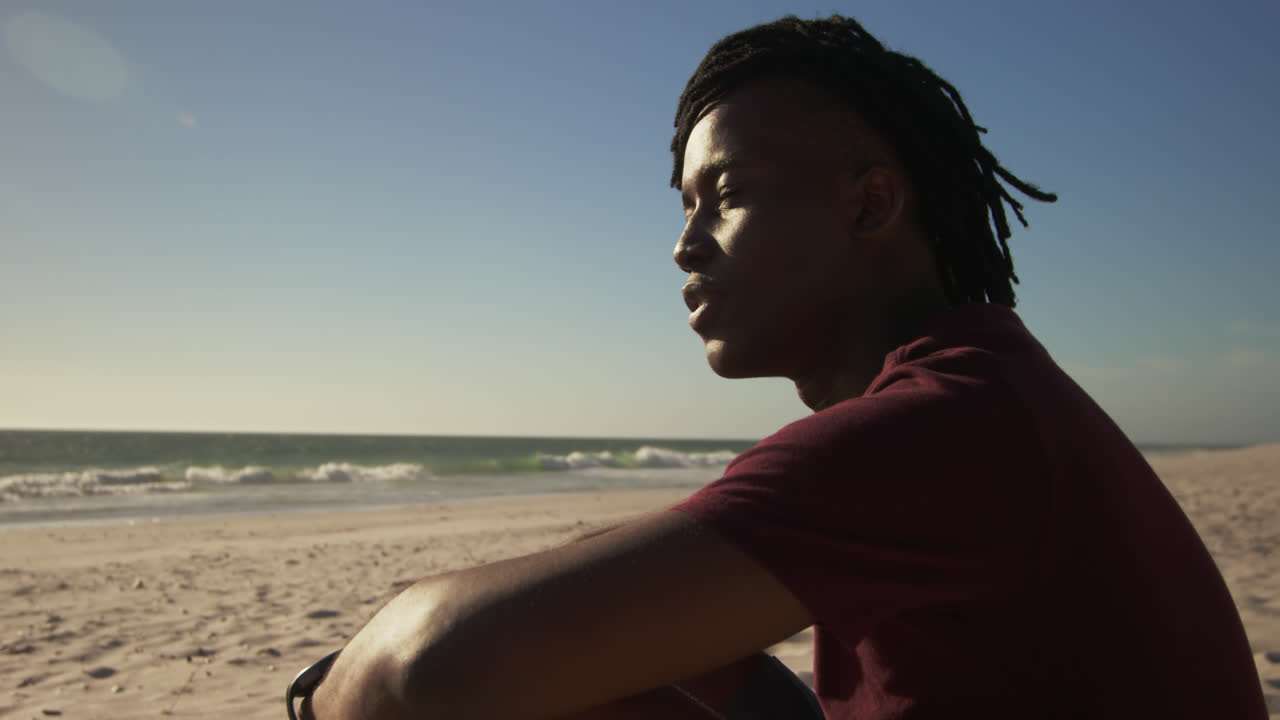 Man relaxing on the beach 4k