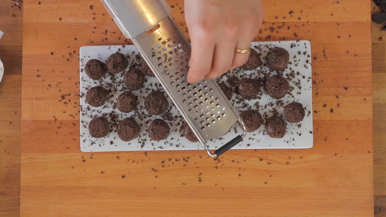 Grating Dark Chocolate Over Homemade Chocolate Truffles