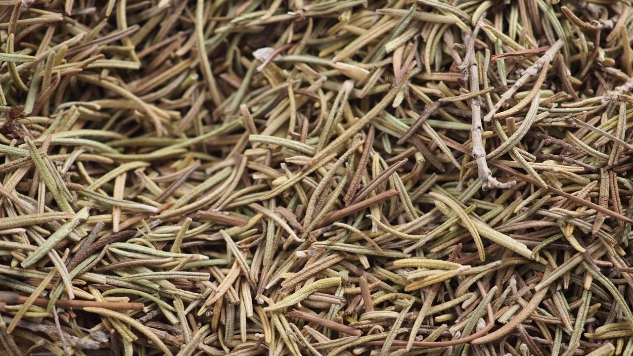 Close-up of Dried Rosemary Leaves and Fresh Rosemary Sprigs