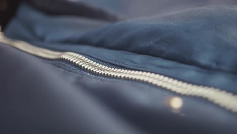 zipper on a blue jacket