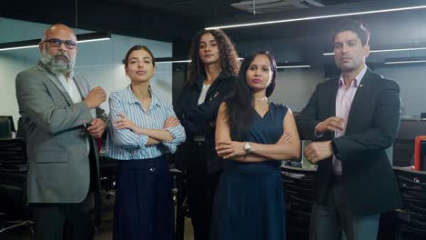 group of indian mixed gender corporate people with folded arms looking at camera