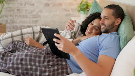 couple, tablet and scroll in bed
