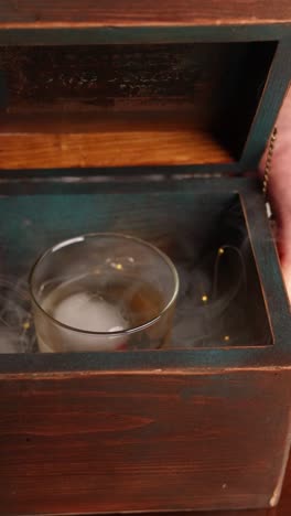 smoked whiskey cocktail in a wooden box