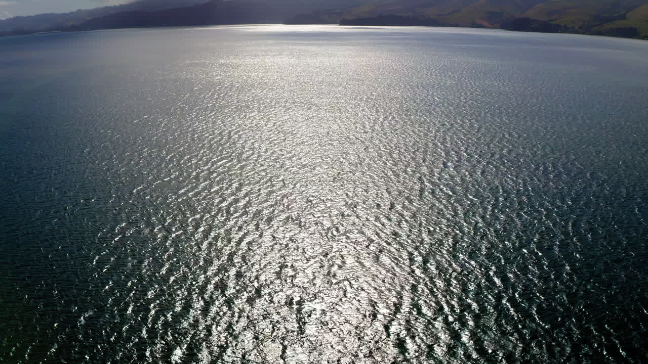 Scenic Bay Landscape with Shimmering Water and Distant Hills