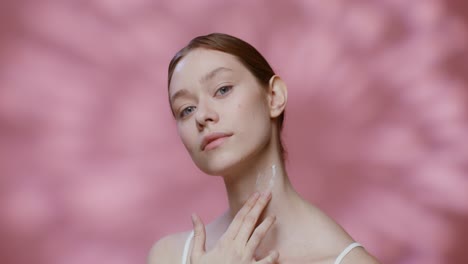 woman applying skincare cream