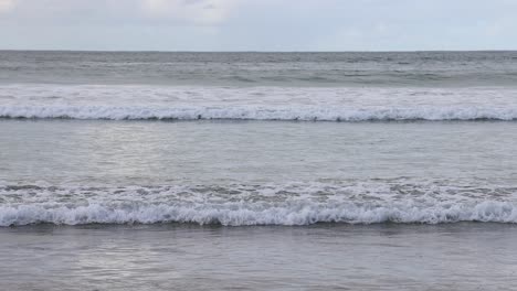 waves rolling onto the shore at great ocean road