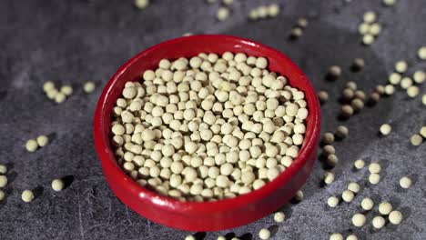 white pepper is placed on a bowl