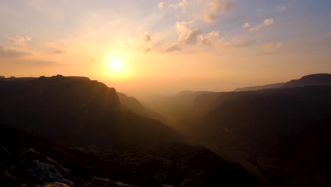time lapse of sunset over dana biosphere reserve and rift valley in jordan, epic rugged mountainous canyon view in middle eastern landscape