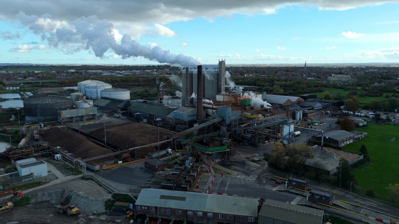 Aerial view of sugar production factory British sugar facility with smoke stacks and chimneys, Rural Newark, United Kingdom