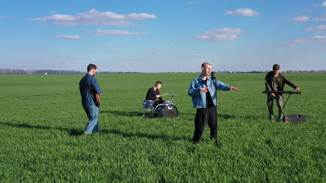 musical group playing outdoors. young band playing concert on field