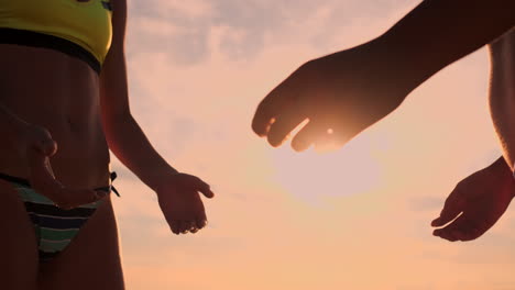 Two-young-girls-giving-high-fives-after-volleyball-match