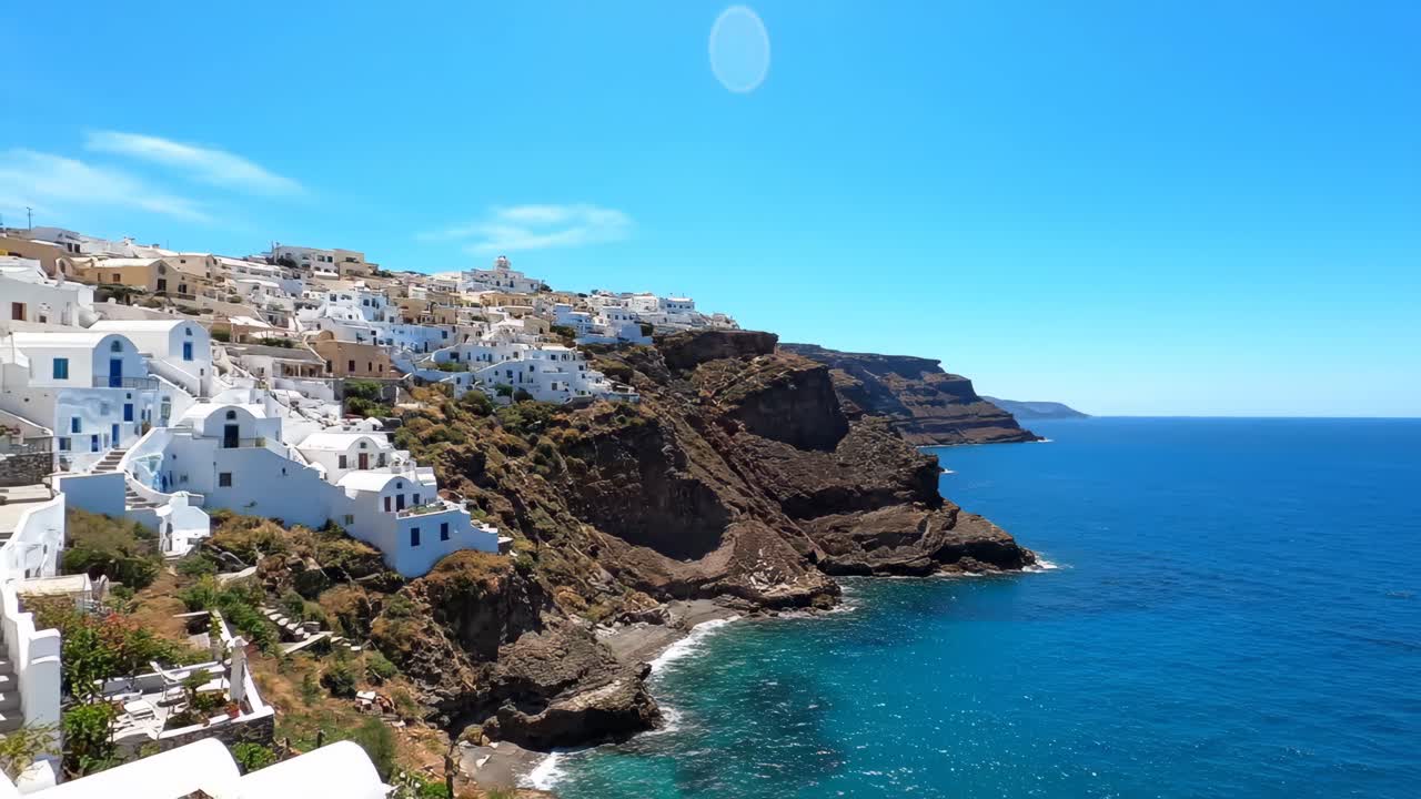 Scenic view of Oia, Santorini with white buildings on a cliff overlooking the Aegean Sea