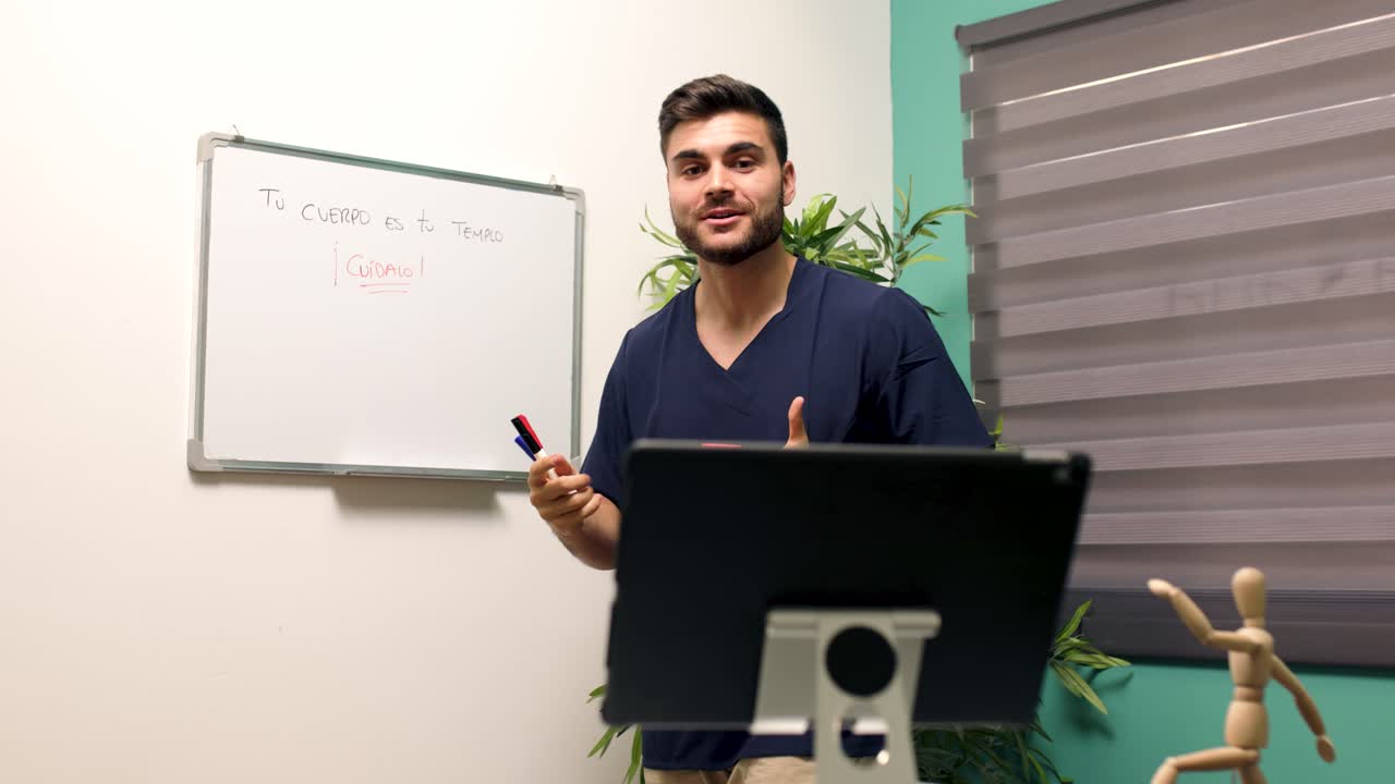 Young Man Demonstrating Resistance Band Exercises in an Online Class