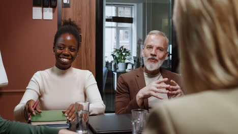 diverse professional team engages in business meeting and discussion