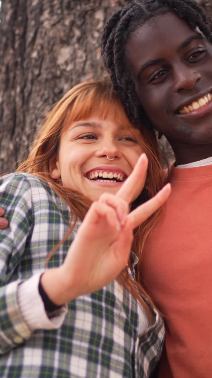 Two people looking at a phone