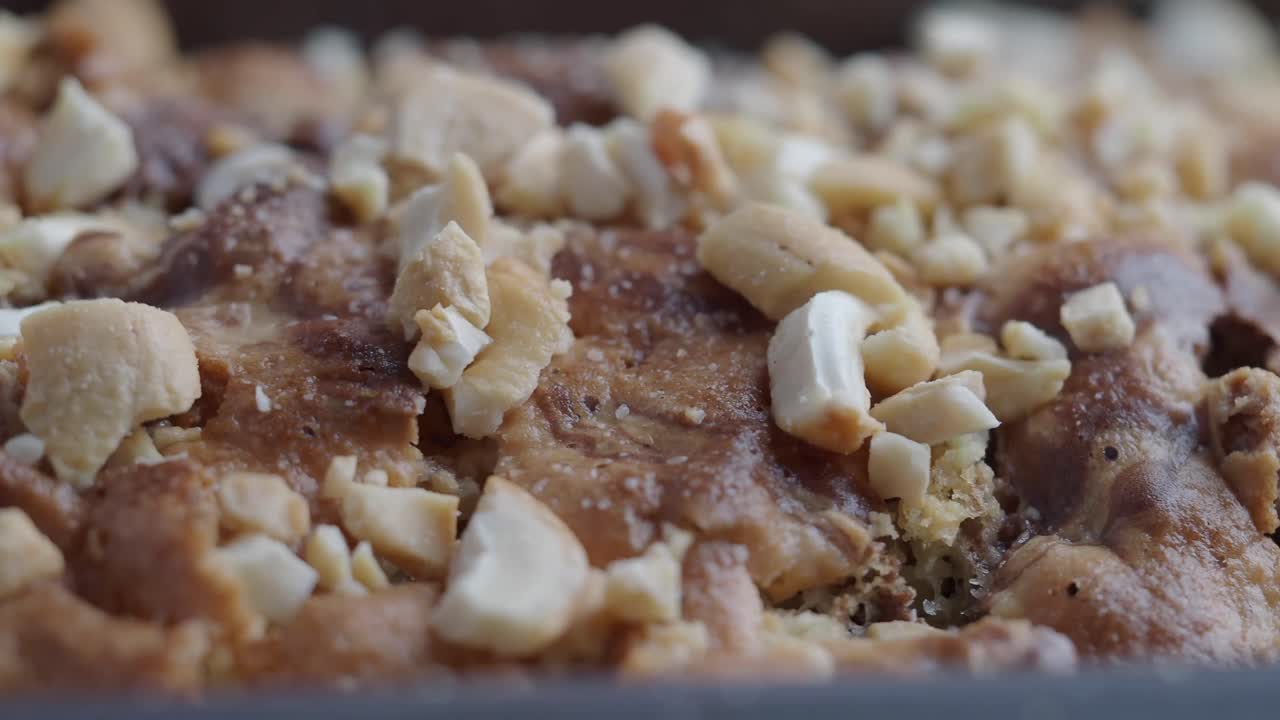 Close-up of Baked Cake Topped with Chopped Cashews