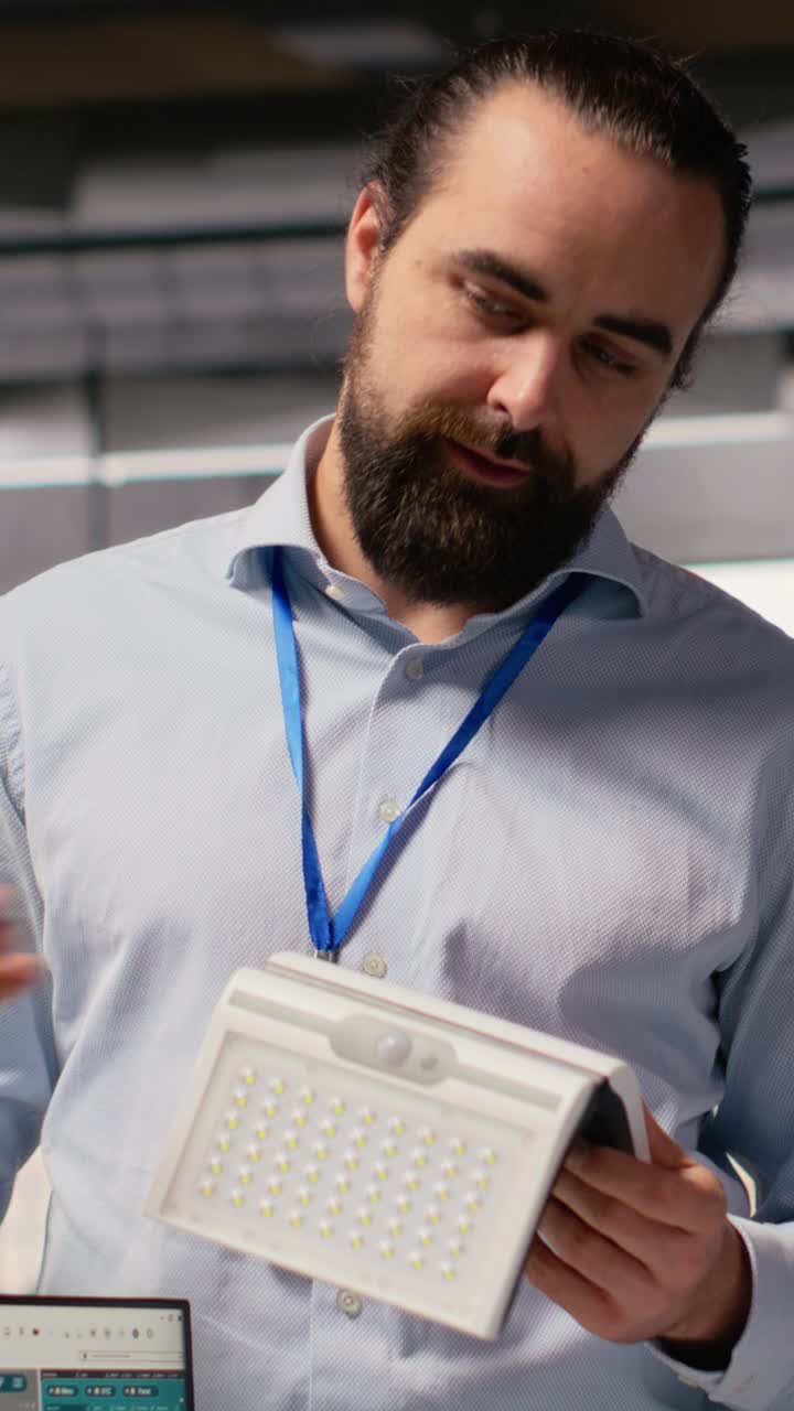 Team of technicians brainstorming solar powered device design