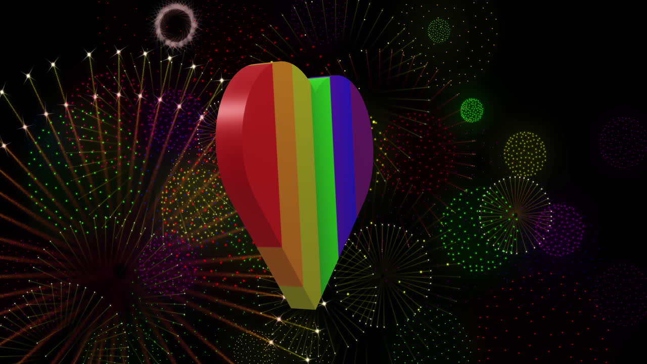 animación del orgullo corazón arco iris y fuegos artificiales explotando sobre fondo negro