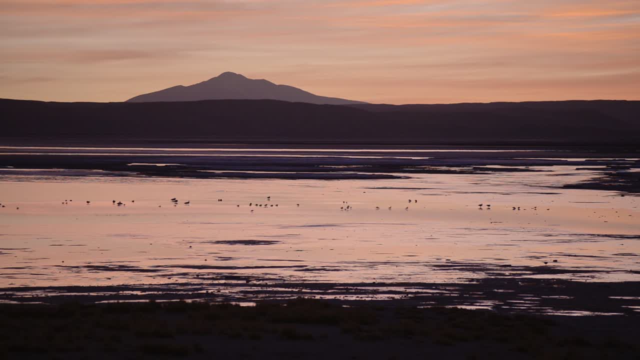 Panoramic landscape view of Salt Flats, Salar de Uyuni, Bolivia, at sunset
