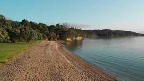 Empty-sand-beach-Cornwallis-in-Auckland,-New-Zealand,-aerial-drone-view