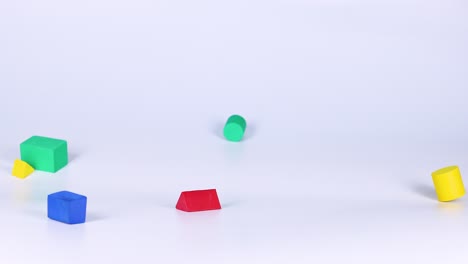 falling and bouncing colorful geometric shapes