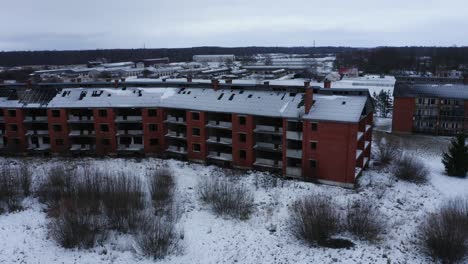 aerial view over abandoned house during winter