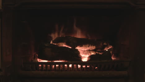 logs burning on a fireplace