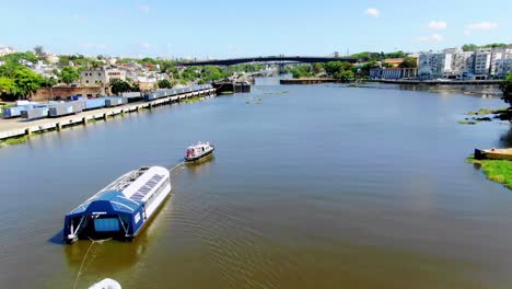 On-a-clear-day-in-the-Dominican-Republic,-Interceptor-004-travels-through-the-waters-of-the-Ozama-River-in-the-Dominican-Republic