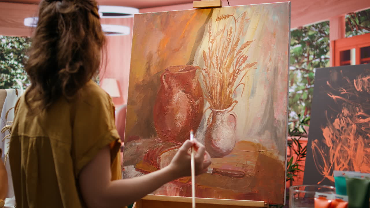 Artist painting a still life of wheat and pitchers