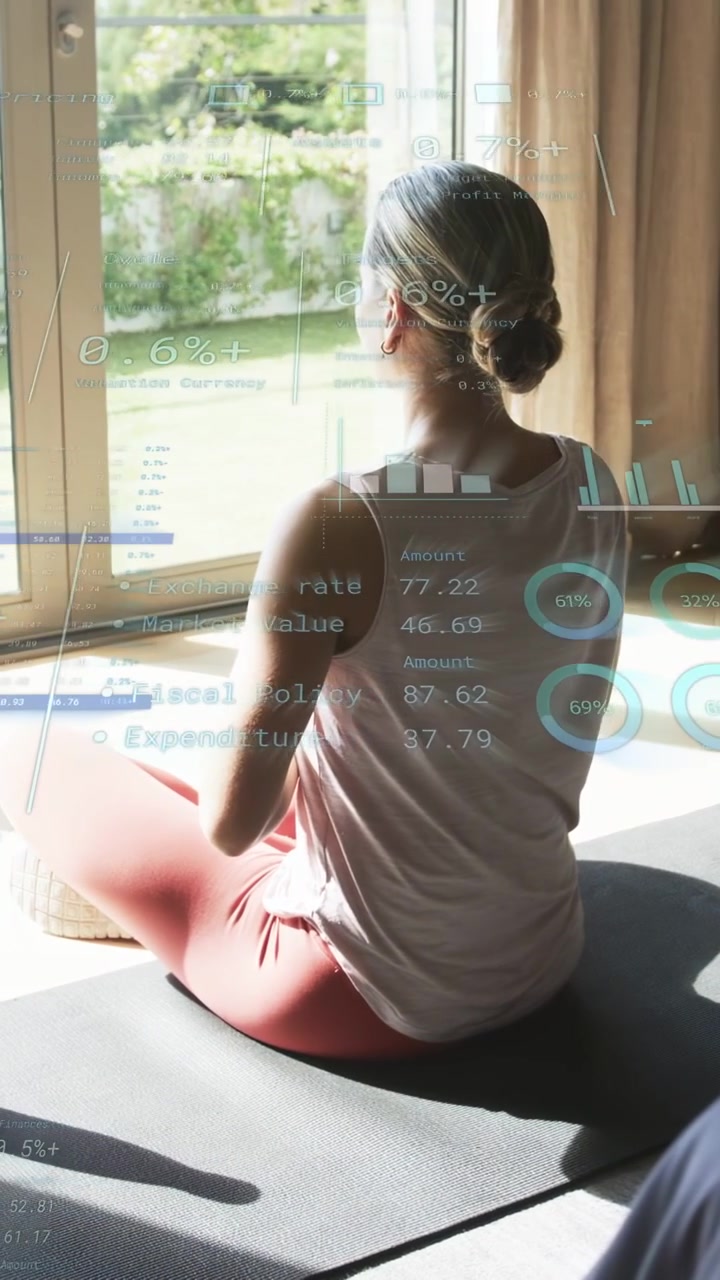 Vertical video: Woman sitting on mat, glancing at window and activating health HUD monitoring data