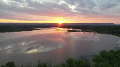 sunrise over a calm river