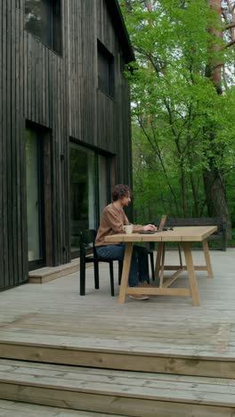 man working from home on a patio