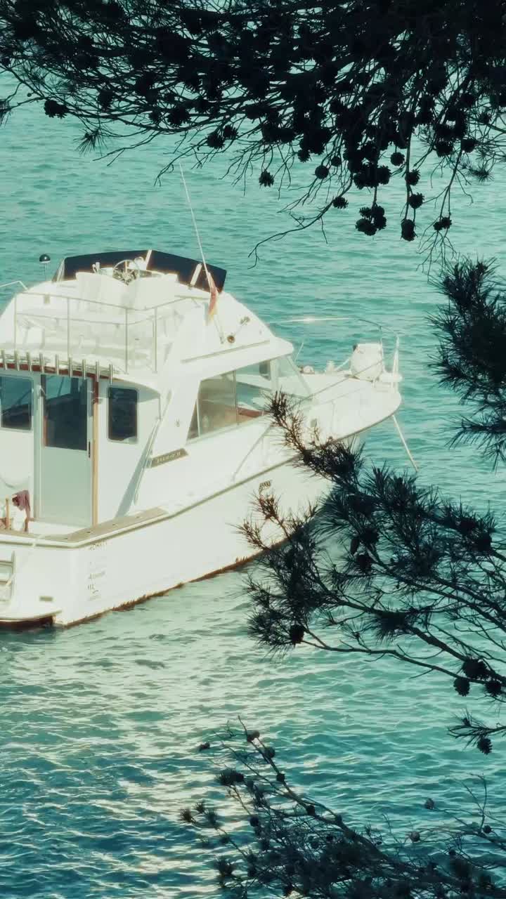 Beautiful vertical footage of boats cruising through Mallorca’s crystal-clear waters, with vibrant marinas and a charming seaside village. Perfect for travel promos and lifestyle content.
