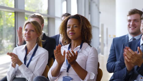 delegates at business conference applauding speaker