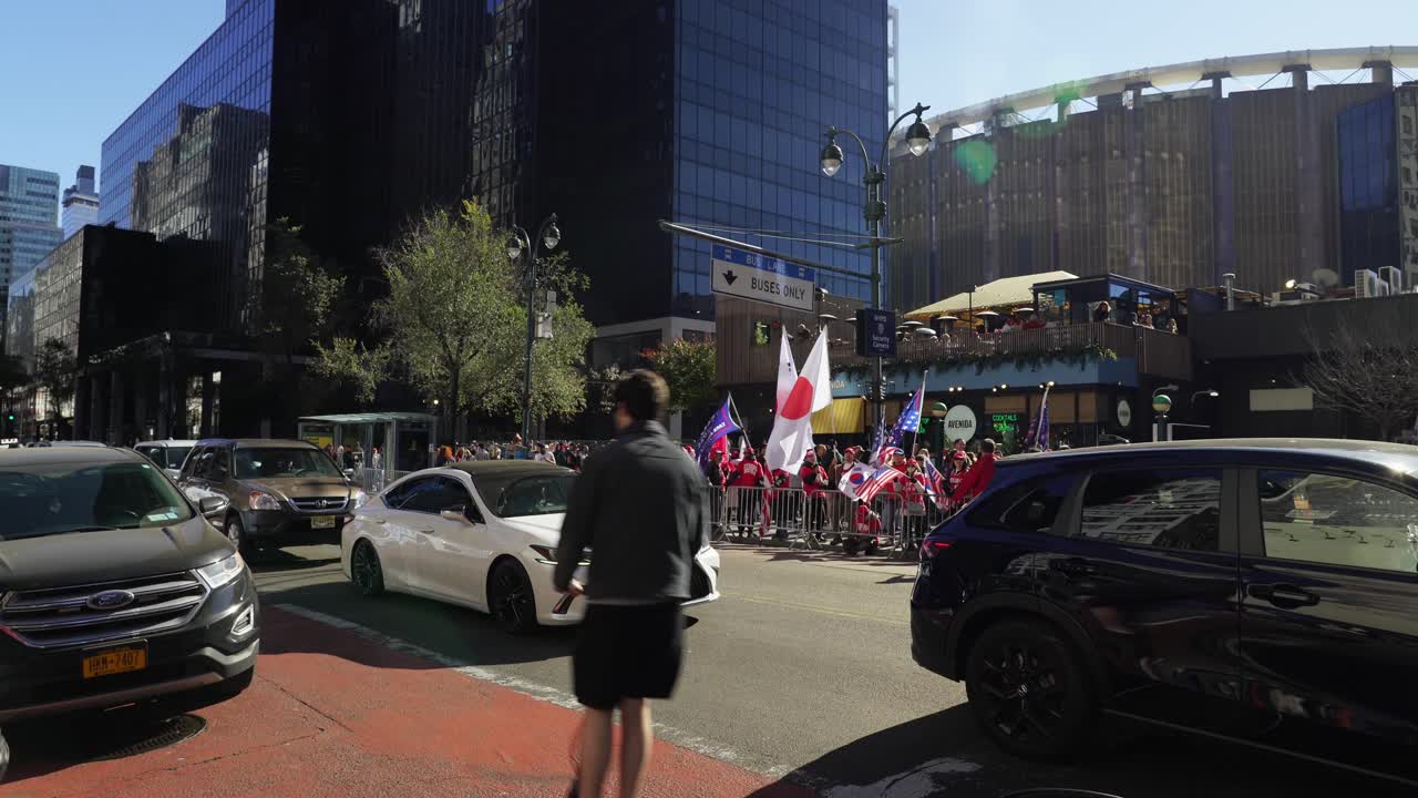 The vibrant energy of Trump’s supporters fills the area around Madison Square Garden in New York, with sunlight illuminating the scene